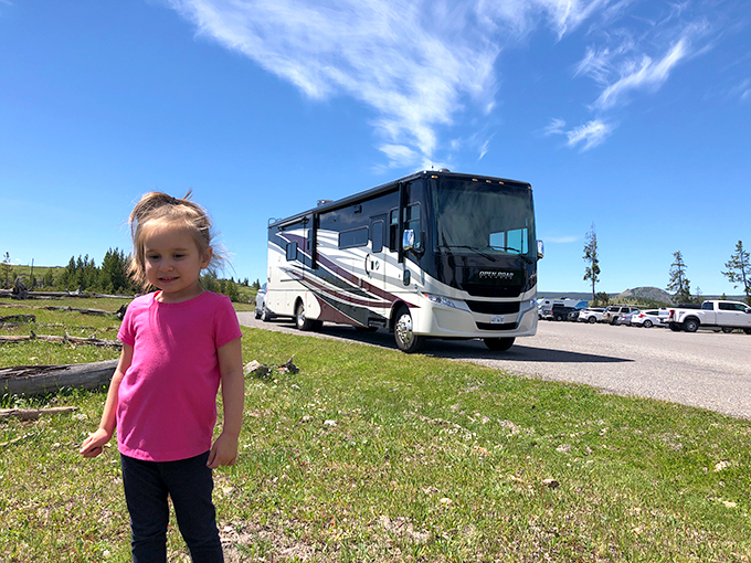 Camille standing in front of our RV 